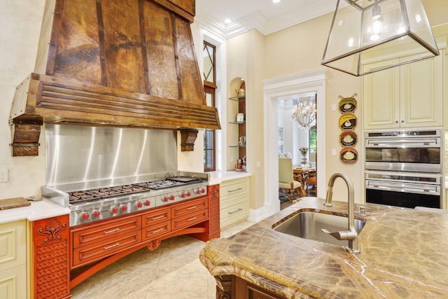 kitchen featuring extractor fan, appliances with stainless steel finishes, built in features, sink, and ornamental molding