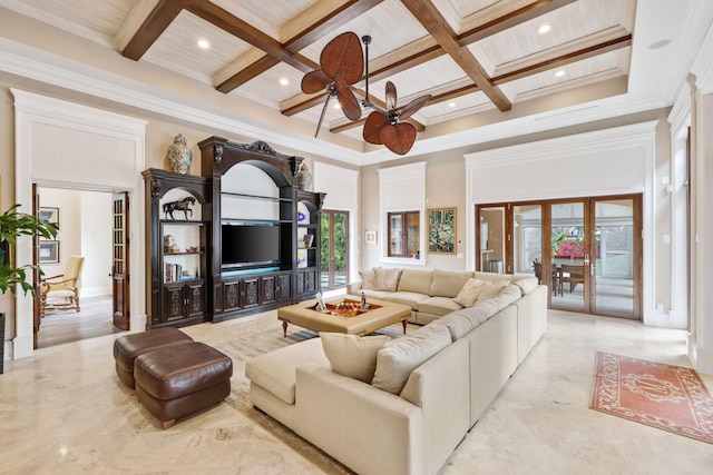 living room with a high ceiling, a healthy amount of sunlight, coffered ceiling, and beamed ceiling