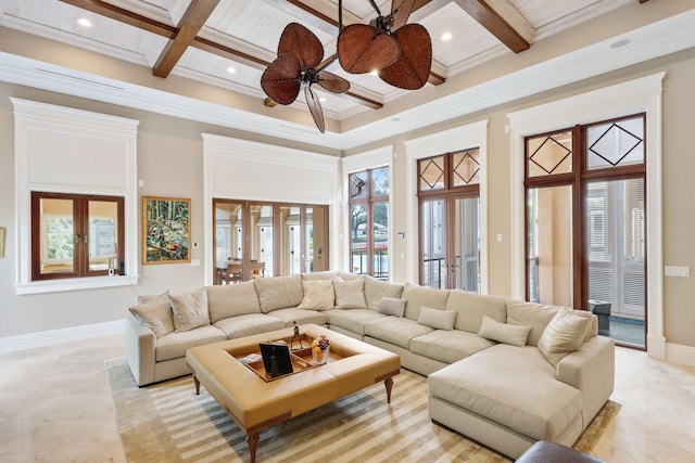 living room featuring coffered ceiling, beam ceiling, and french doors