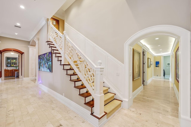 stairs featuring ornamental molding