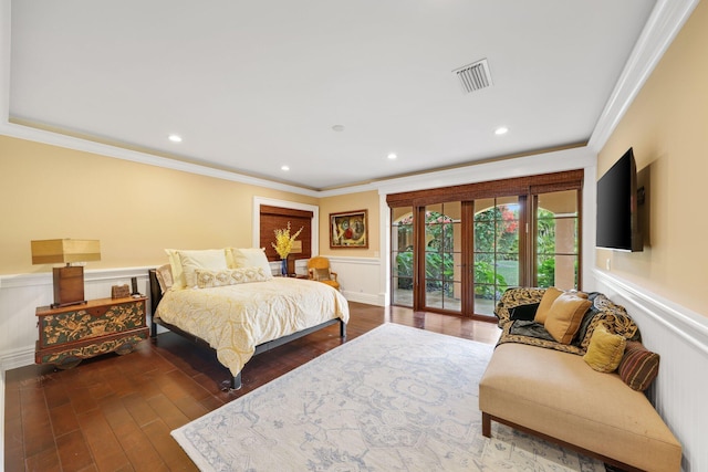 bedroom featuring access to exterior, dark wood-type flooring, ornamental molding, and french doors