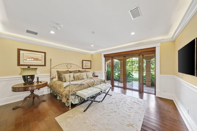 bedroom with access to exterior, dark wood-type flooring, ornamental molding, and french doors