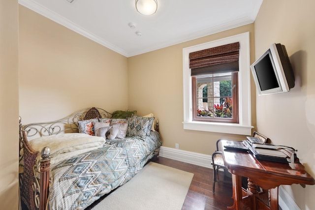 bedroom featuring ornamental molding and dark hardwood / wood-style floors