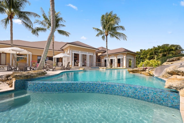 view of swimming pool featuring a patio area