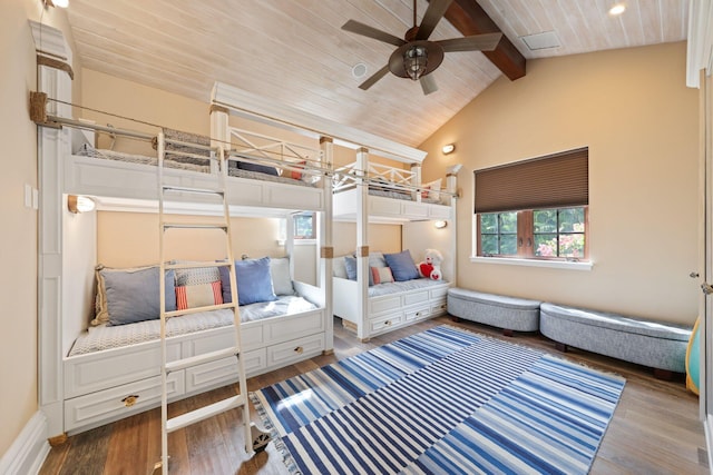 bedroom with hardwood / wood-style flooring, ceiling fan, lofted ceiling with beams, and wooden ceiling