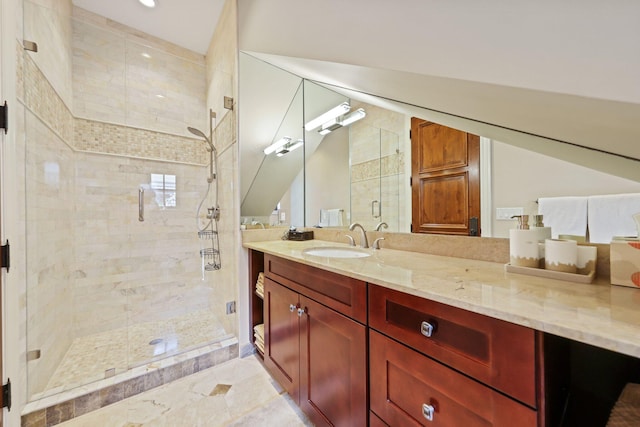 bathroom with vanity and a shower with door