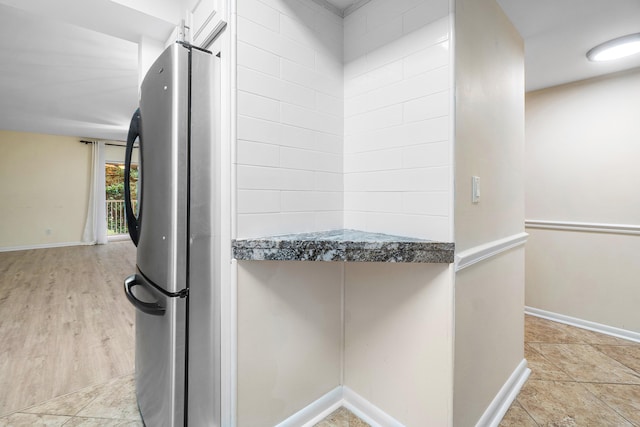 kitchen featuring stainless steel refrigerator