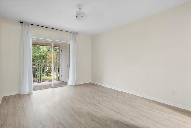 empty room with light hardwood / wood-style flooring