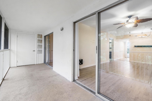 interior space featuring ceiling fan