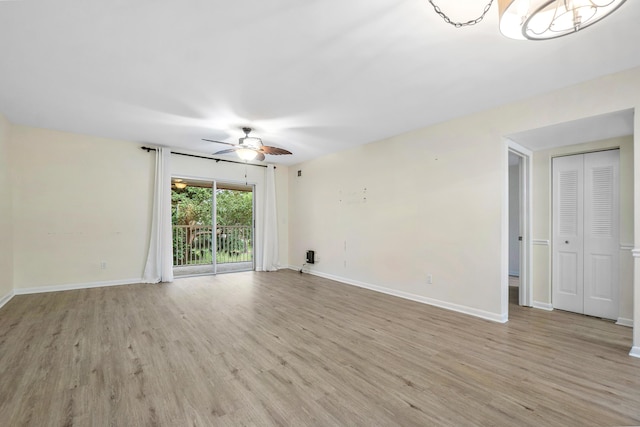 unfurnished room featuring light wood-type flooring and ceiling fan