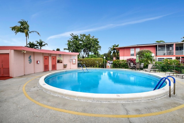 view of swimming pool with a patio