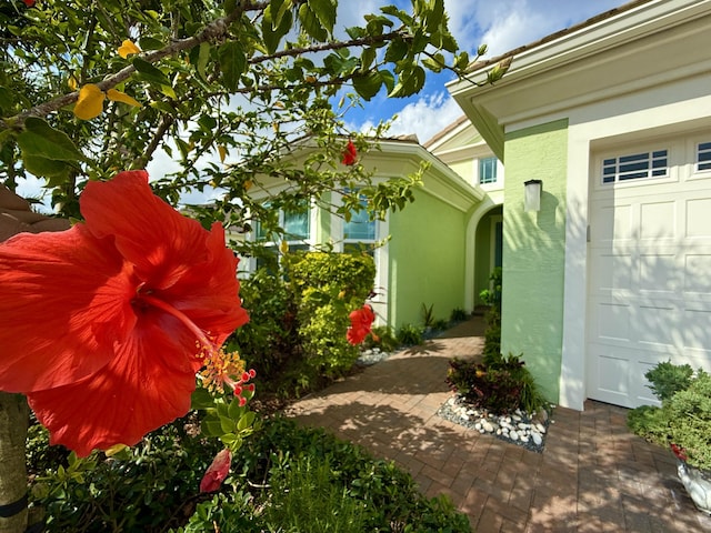 view of side of home featuring a garage