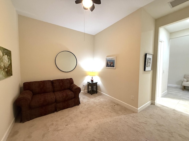 sitting room featuring ceiling fan and light carpet