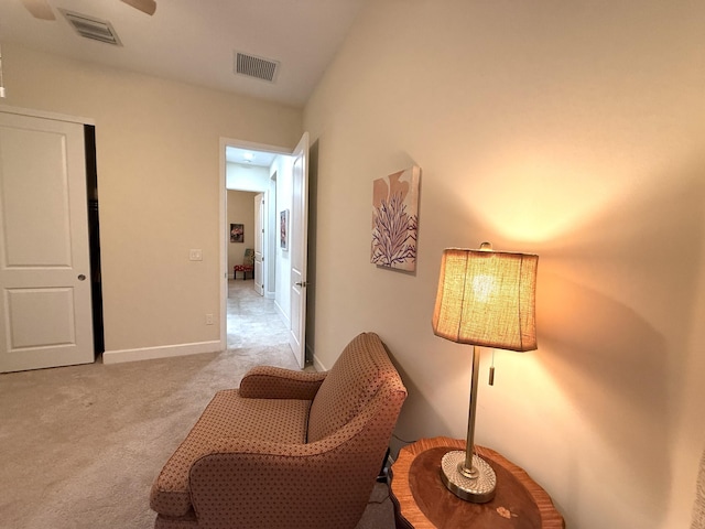 living area with light colored carpet