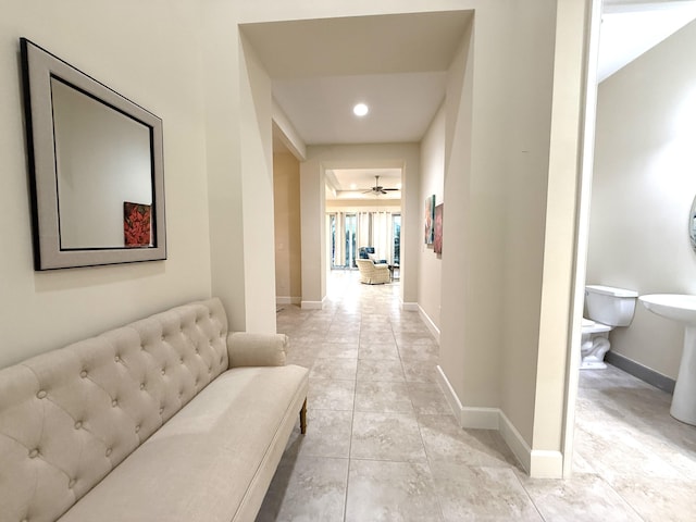 hall with light tile patterned flooring