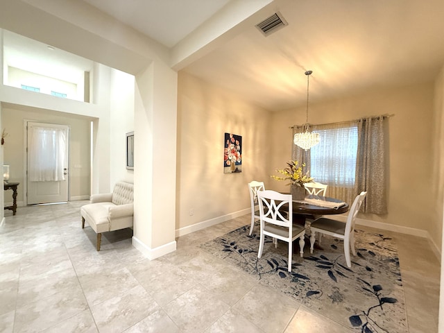 dining room featuring plenty of natural light and a chandelier