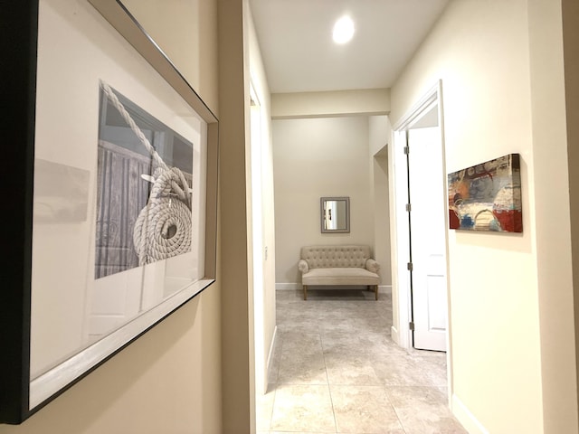 hallway with light tile patterned floors