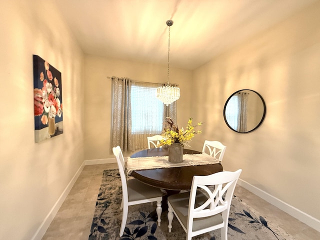 dining space with an inviting chandelier