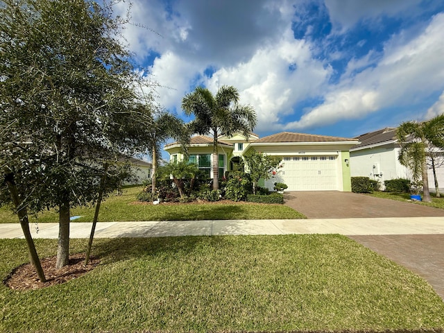 view of front of house with a front lawn and a garage