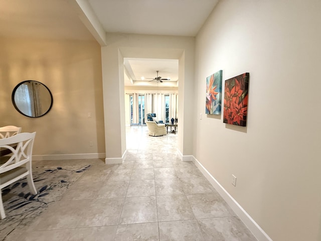 corridor with light tile patterned floors