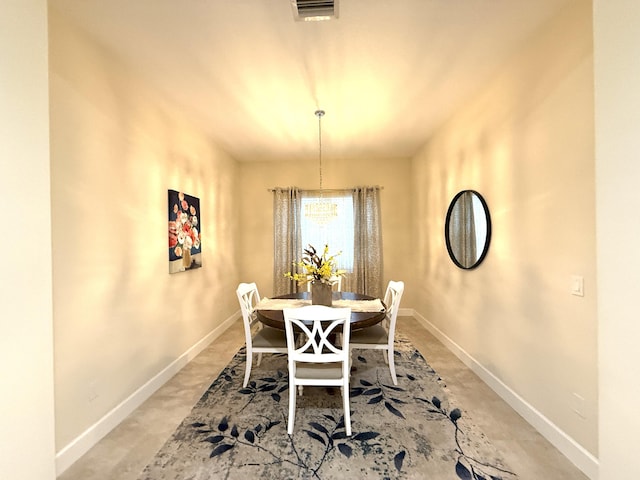 dining area with a chandelier