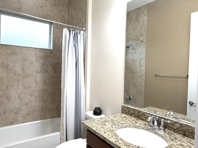 full bathroom featuring toilet, vanity, and shower / bathtub combination with curtain