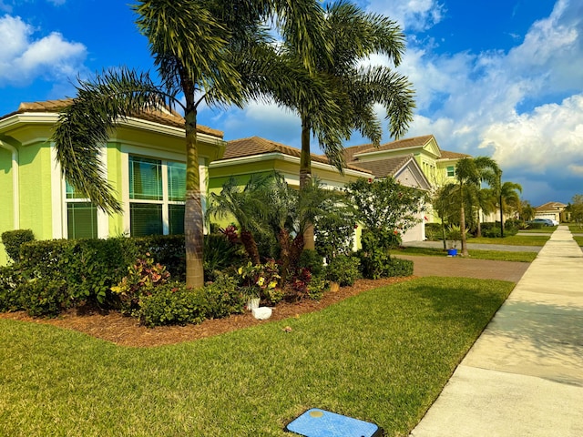 view of home's exterior with a lawn