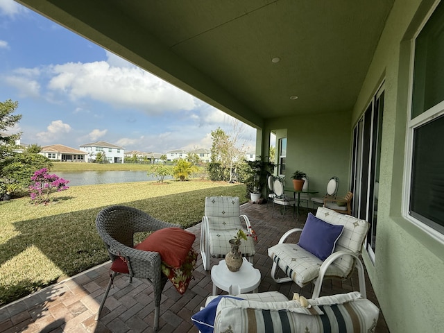 view of patio featuring a water view