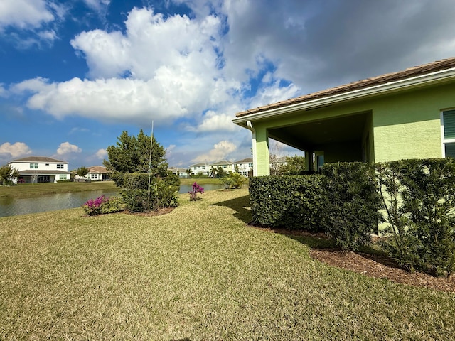 view of yard with a water view