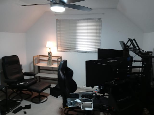 office area featuring ceiling fan, carpet floors, and vaulted ceiling