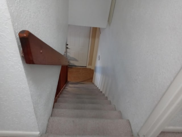 5266 Greenwood Dr, Delray Beach, FL 33484 - staircase featuring a textured wall