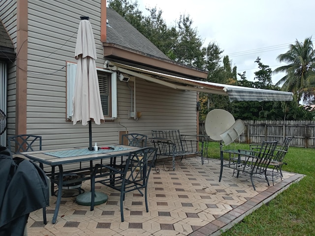 5266 Greenwood Dr, Delray Beach, FL 33484 - view of patio / terrace featuring outdoor dining space and fence