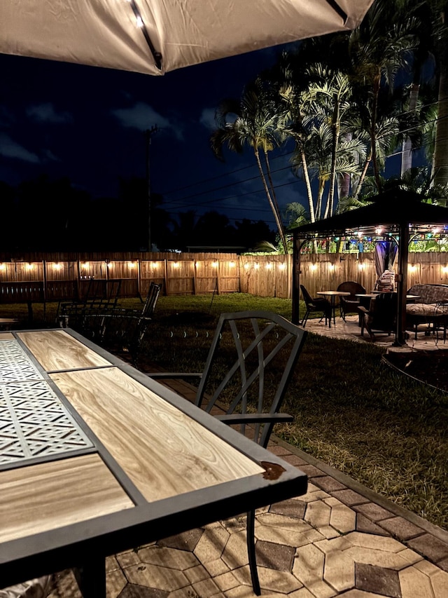 5266 Greenwood Dr, Delray Beach, FL 33484 - patio at twilight with a fenced backyard