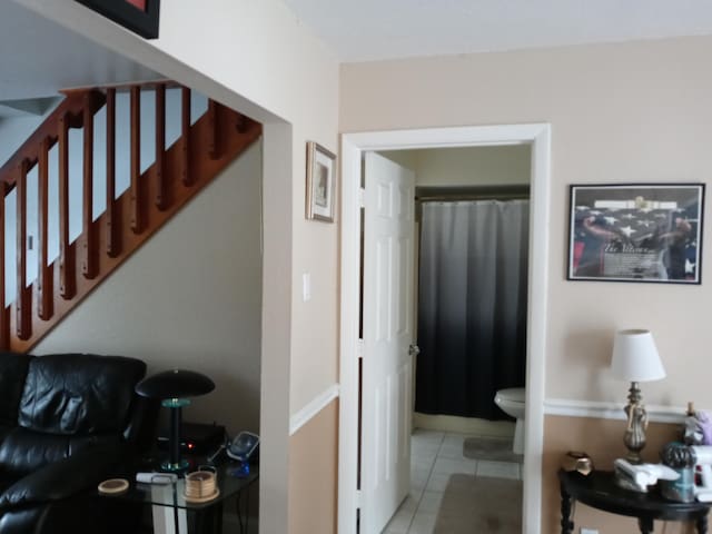 5266 Greenwood Dr, Delray Beach, FL 33484 - hallway with light tile patterned flooring and stairs