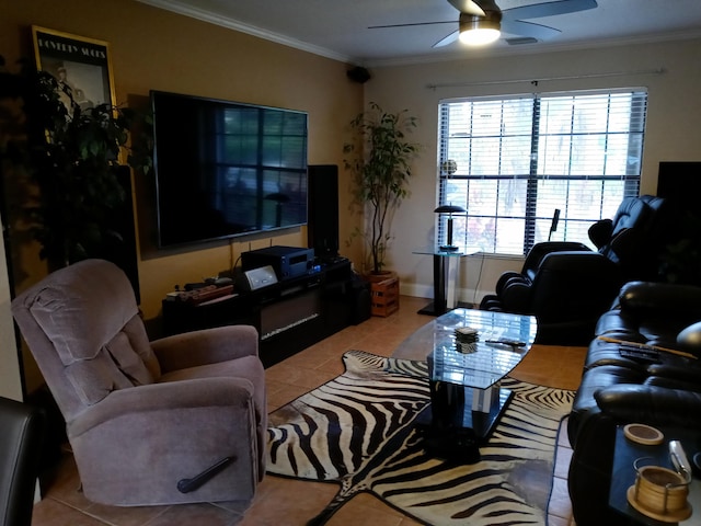 tiled living room with ceiling fan and crown molding