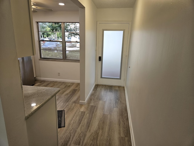 entryway featuring ceiling fan and light hardwood / wood-style floors