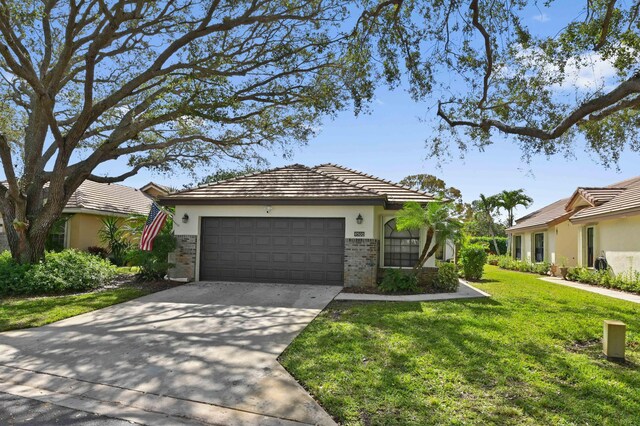 view of property exterior with a garage and a lawn