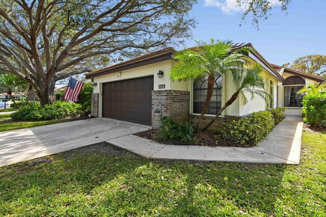 view of side of home featuring a garage and a yard