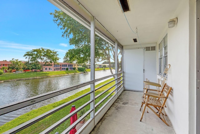 sunroom with a water view