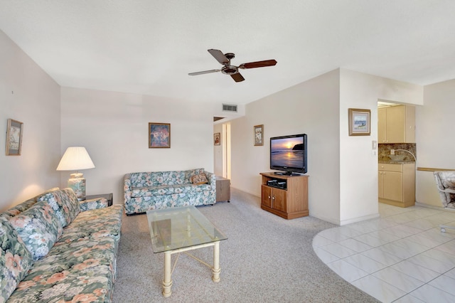 tiled living room featuring ceiling fan