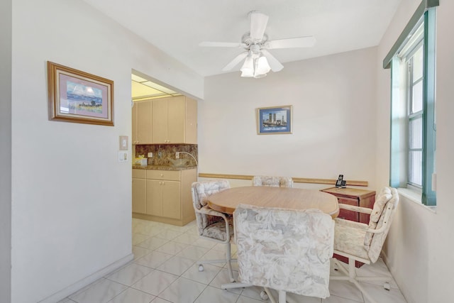 tiled dining room featuring ceiling fan