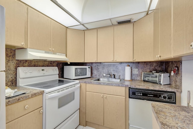 kitchen featuring tasteful backsplash, light brown cabinets, sink, and white appliances