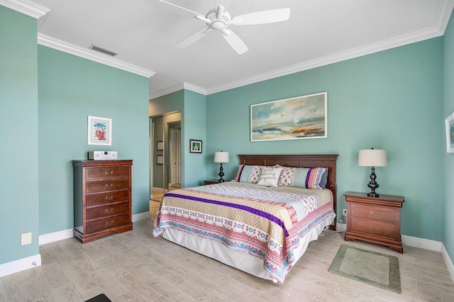 bedroom with ceiling fan, crown molding, light wood-type flooring, a textured ceiling, and a closet