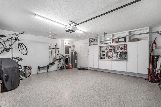 garage with water heater, a garage door opener, electric panel, and ceiling fan