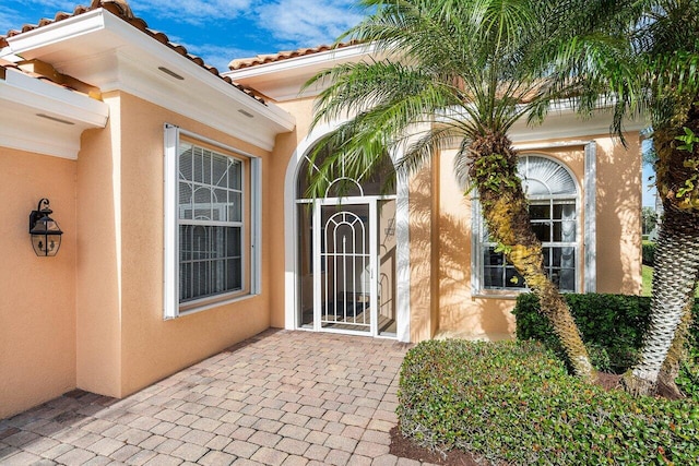 entrance to property featuring a patio area