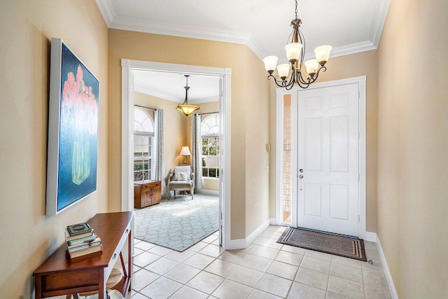 tiled entryway with an inviting chandelier and crown molding