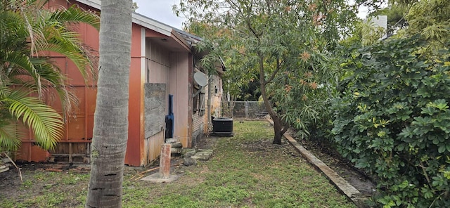 view of yard featuring central air condition unit