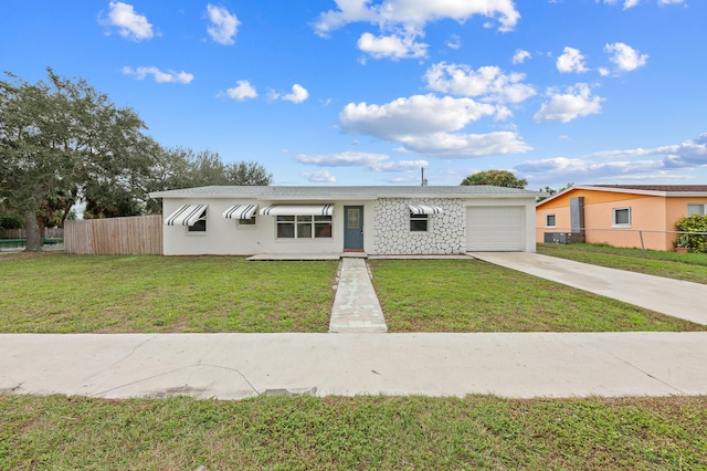 single story home with a front lawn and a garage