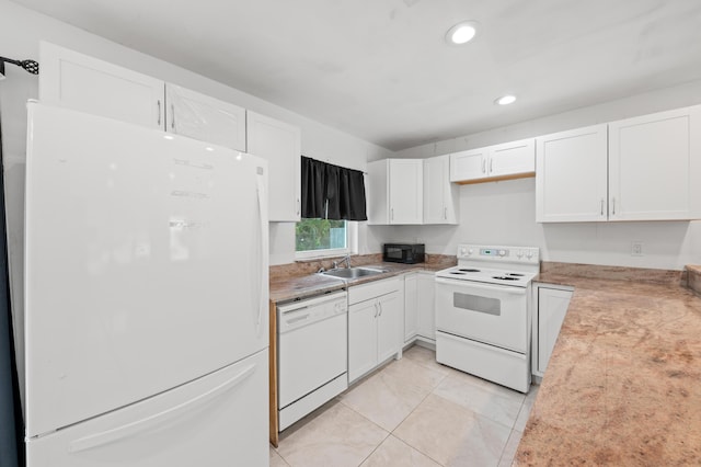 kitchen featuring sink, white appliances, white cabinetry, and light tile patterned flooring