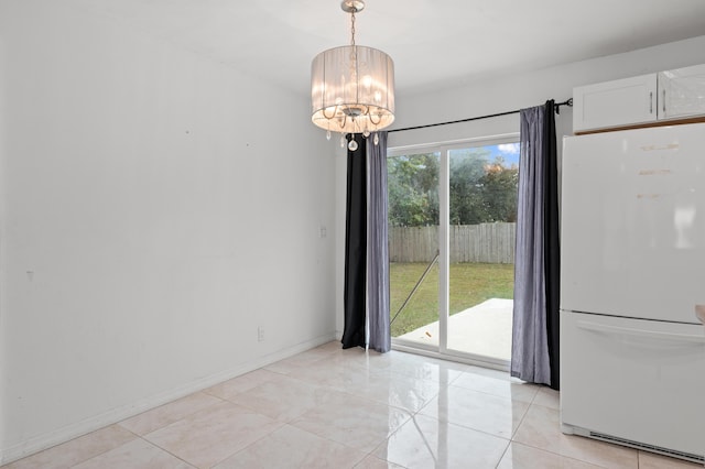 unfurnished dining area featuring a notable chandelier